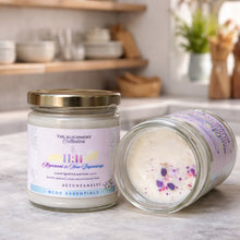 Rcdcessentials scented soy candle jar with a visible crystals inside on a kitchen counter