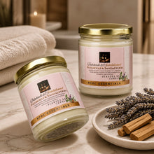 Two jars of RCDC Essentials candles with lavender and sandalwood on a marble surface.