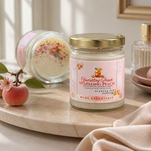 Jar of 'Sparkling Peach' candle on a marble surface with decorative elements.