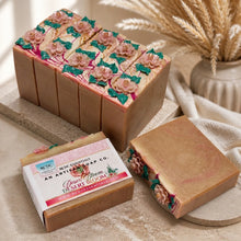 Decorative soap bars with floral designs on a neutral background