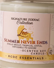 Close-up of a candle jar label reading 'Signature Zodiac Collection Leo Summer Never Ends' with 'RCDC Essentials' at the bottom, showing a cream-colored candle in a glass container.