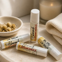Lip balms with chamomile on a marble surface