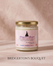 A glass jar candle with a gold metal lid and a light pink label reading Bridgerton's Bouquet, set against a soft pink textured background with the brand name printed below the product.