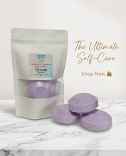 A stand-up pouch of lavender bath bombs with three round lavender bath bombs displayed in front on a white marble surface against a white background, with promotional text on the right.
