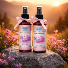 Handmade fragrance body mist by RCDCessentials Two bottles of 'Born Of Roma' body mist with pink ribbons against a natural background. 