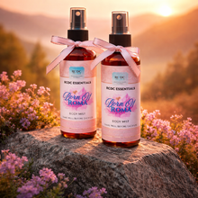 Handmade fragrance body mist by RCDCessentials Two bottles of 'Born Of Roma' body mist with pink ribbons against a natural background. 
